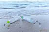 Garbage in the sea with plastic bottle on beach sandy dirty sea on the island / Environmental problem of plastic rubbish pollution in ocean