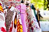 closeup of some clothes hanging on a rack in a street market
