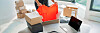 Online store selling clothes on website working on laptop ecommerce business from home. Woman packing new clothing fashion purchase in shipping packages for delivery. Panoramic banner.