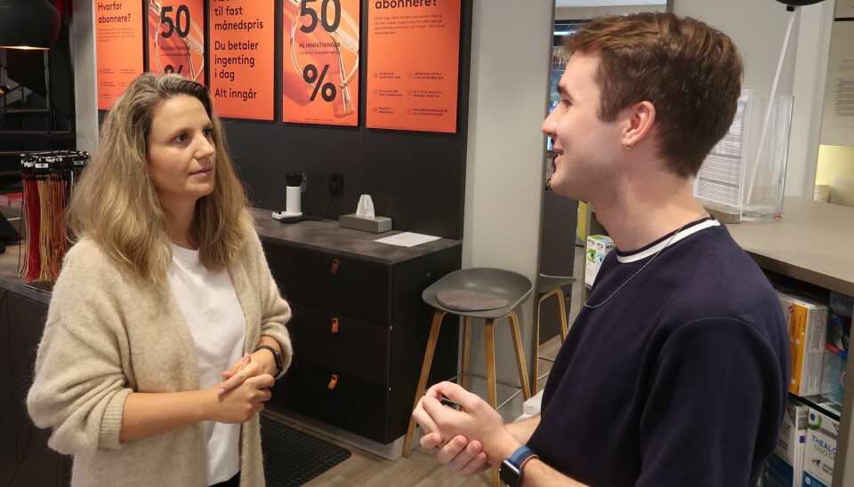 Shop Manager Azra Trnka and Customer Service Representative Markus Olsen discussing customer feedback from the Maze app.