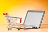 Internet online shopping concept with computer and cart